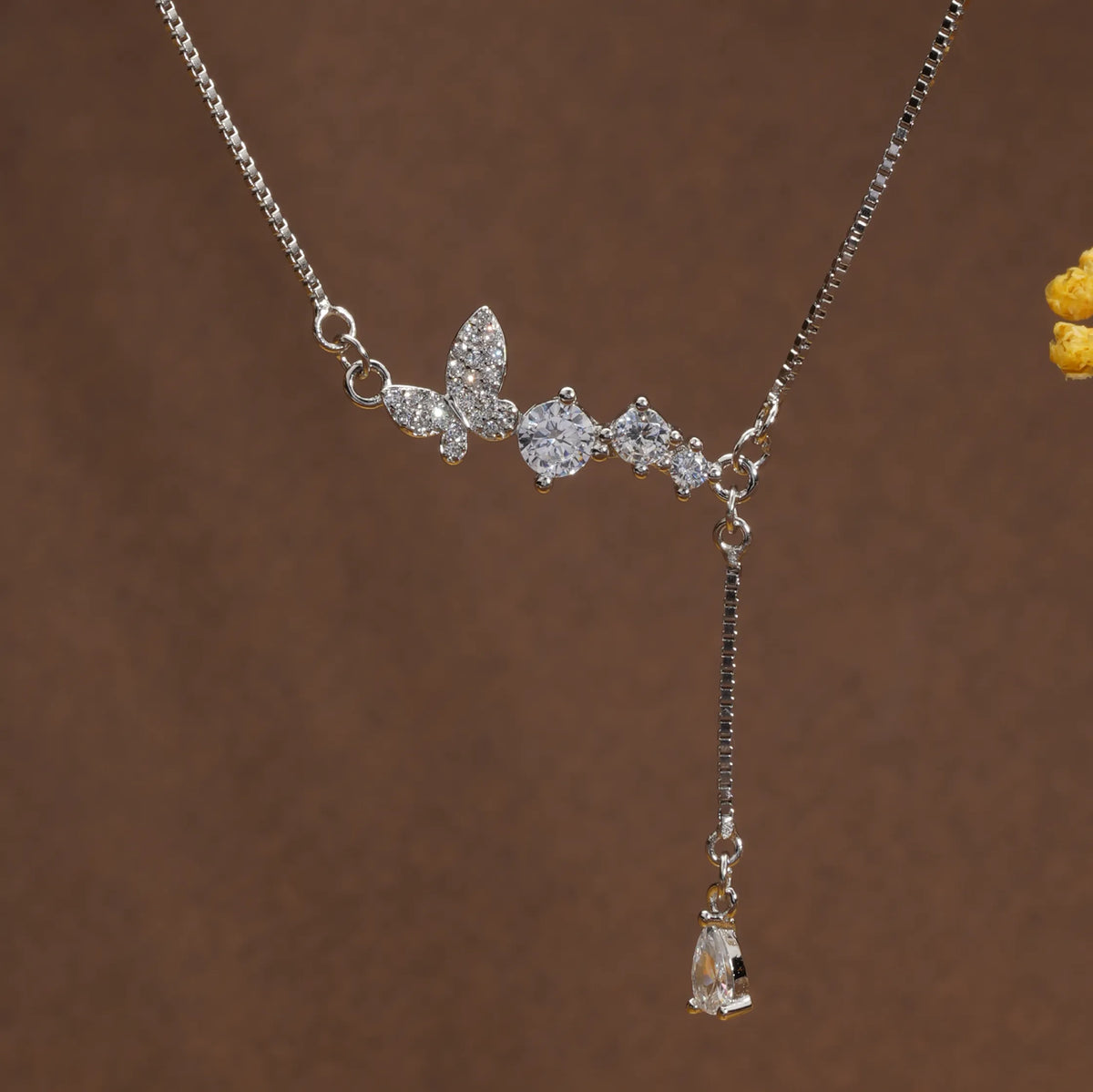 Trailing bud & butterfly chain
